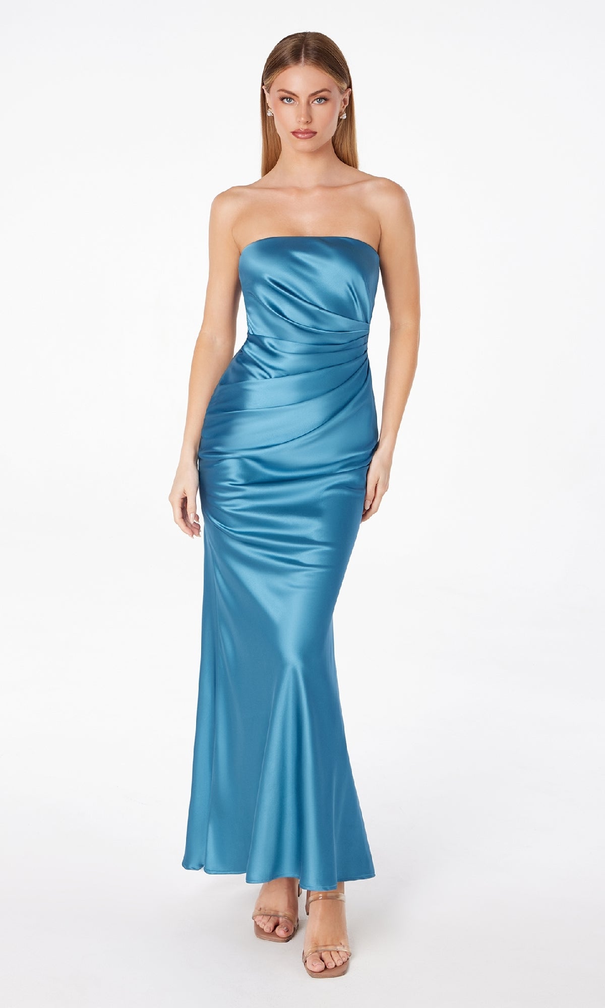 Model wears the Astee T2006 Strapless Long Satin Maxi Prom Dress in teal with a fitted silhouette and nude high-heeled sandals, standing against a white background.